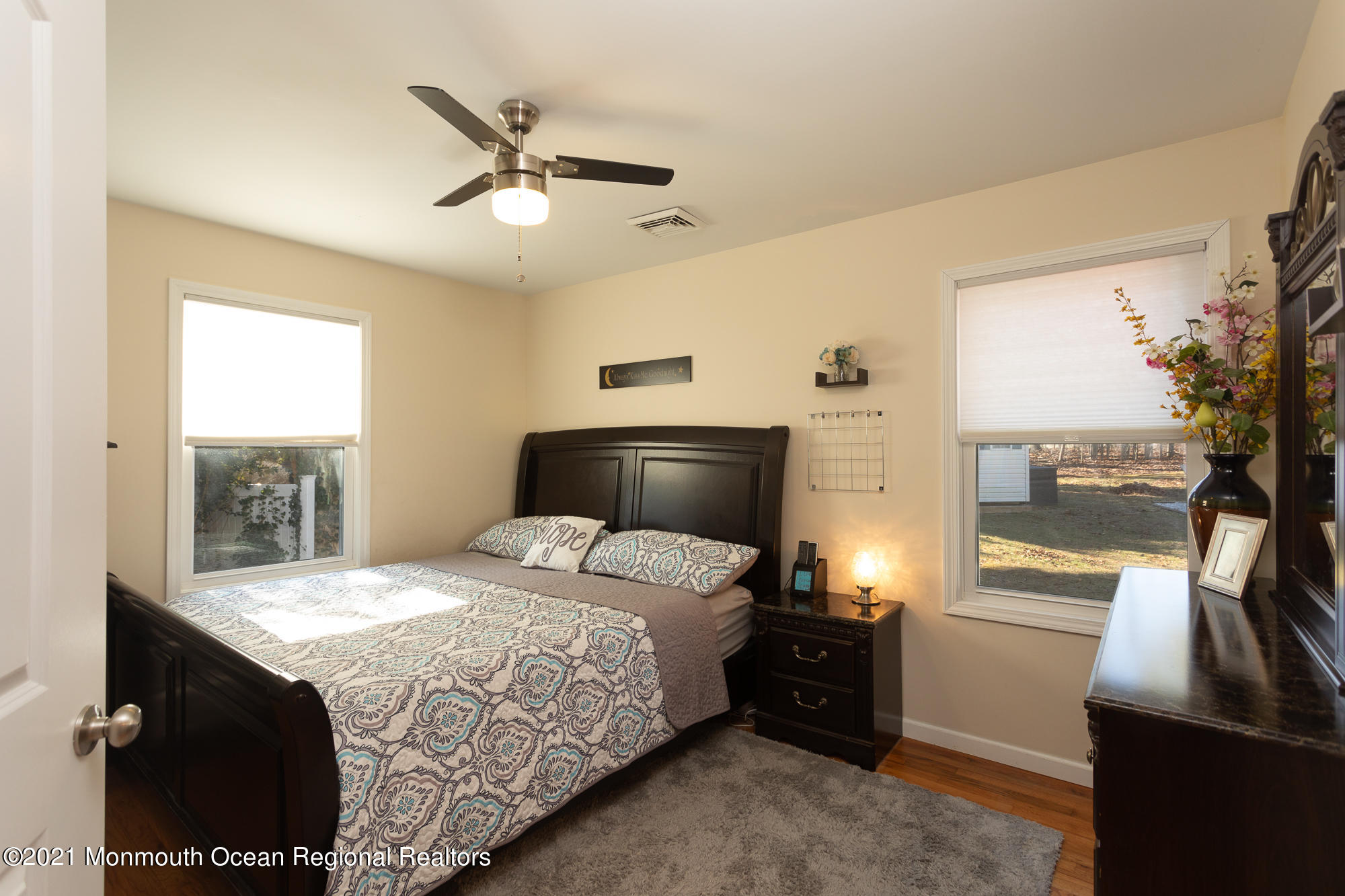 116 Toggle Road Manahawkin, NJ 08050 - Photo 16 of 26 a bedroom with a bed and a ceiling fan