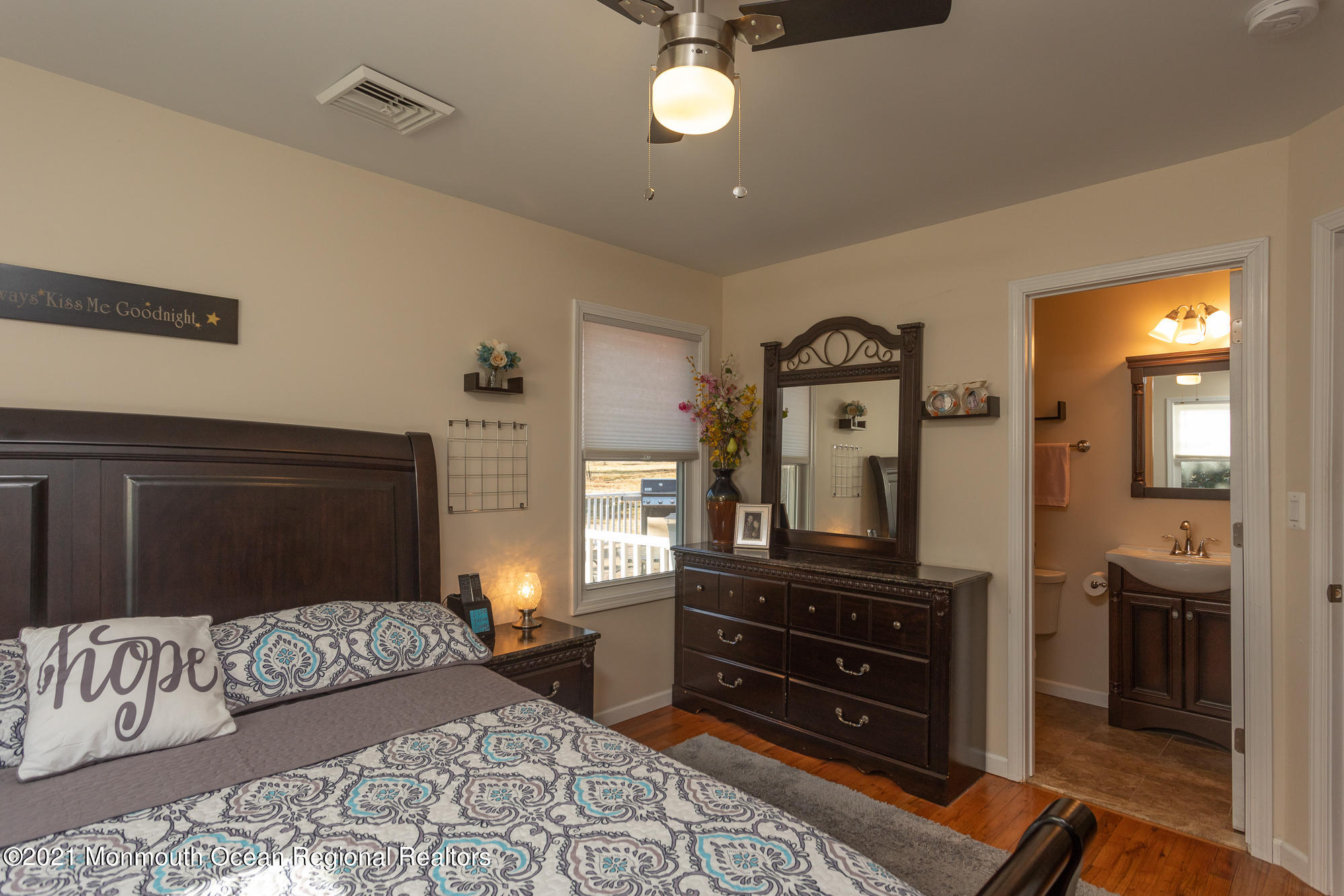 116 Toggle Road Manahawkin, NJ 08050 - Photo 17 of 26 a bedroom with a bed and a television on dresser