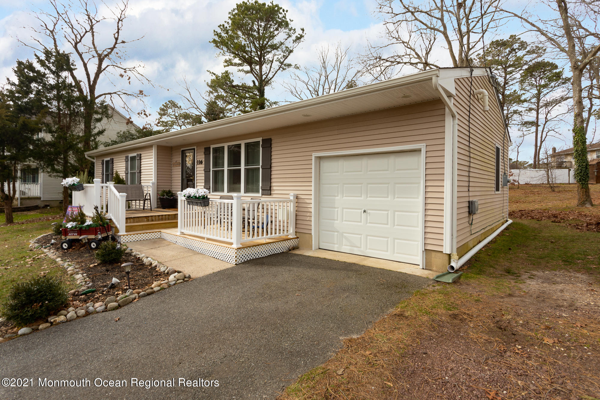 116 Toggle Road Manahawkin, NJ 08050 - Photo 3 of 26 a view of a house with a yard covered in snow