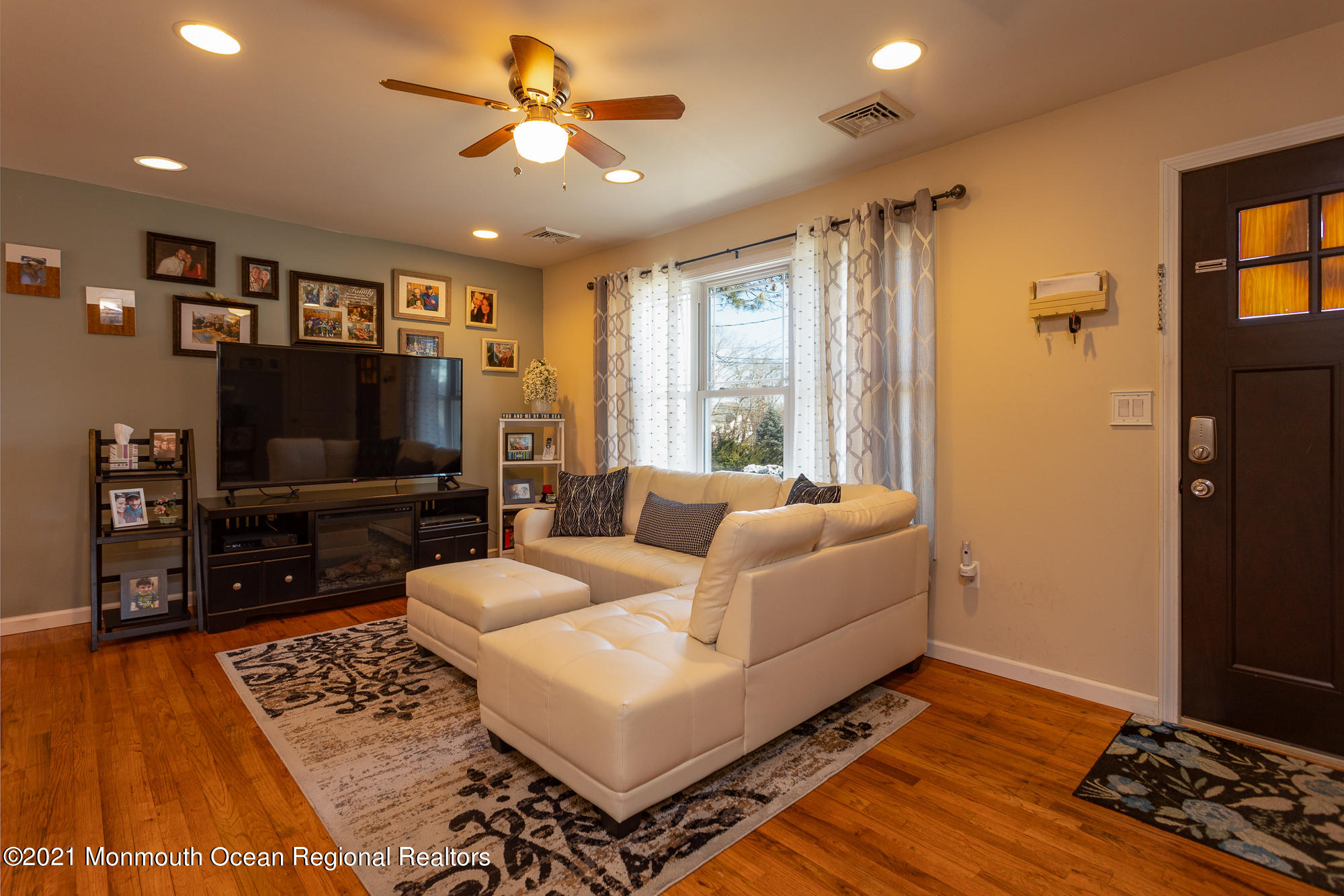 116 Toggle Road Manahawkin, NJ 08050 - Photo 8 of 26 a living room with furniture and a flat screen tv