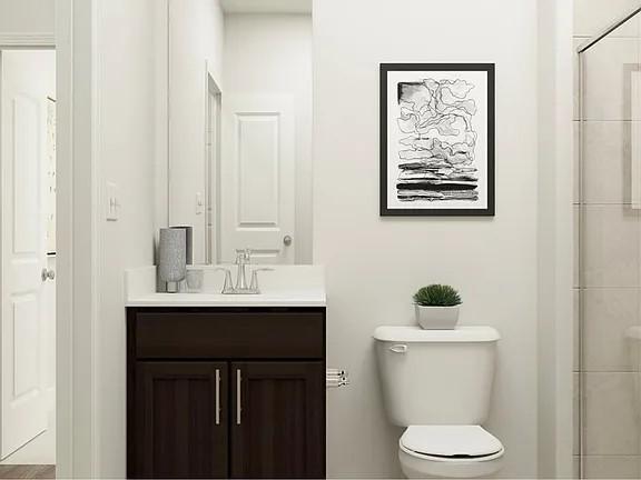 208 Eden View Bend Raleigh, NC 27610 - Photo 2 of 14 a bathroom with a toilet sink and mirror