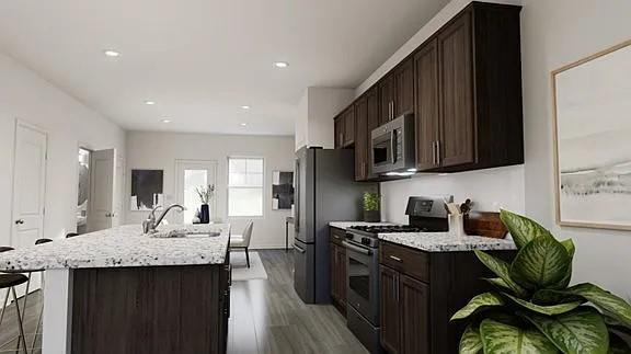 208 Eden View Bend Raleigh, NC 27610 - Photo 10 of 14 a kitchen with a sink stove and microwave