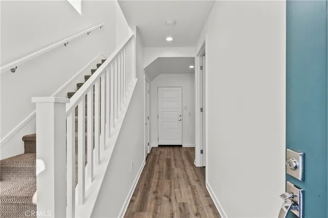 a bathroom with a shower sink vanity mirror and toilet