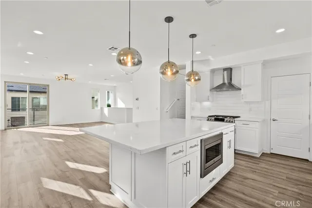 a bathroom with a shower sink and mirror