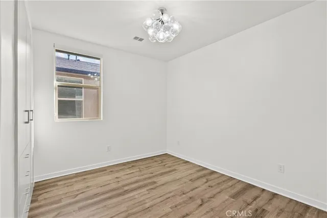a view of a patio with couches and potted plants