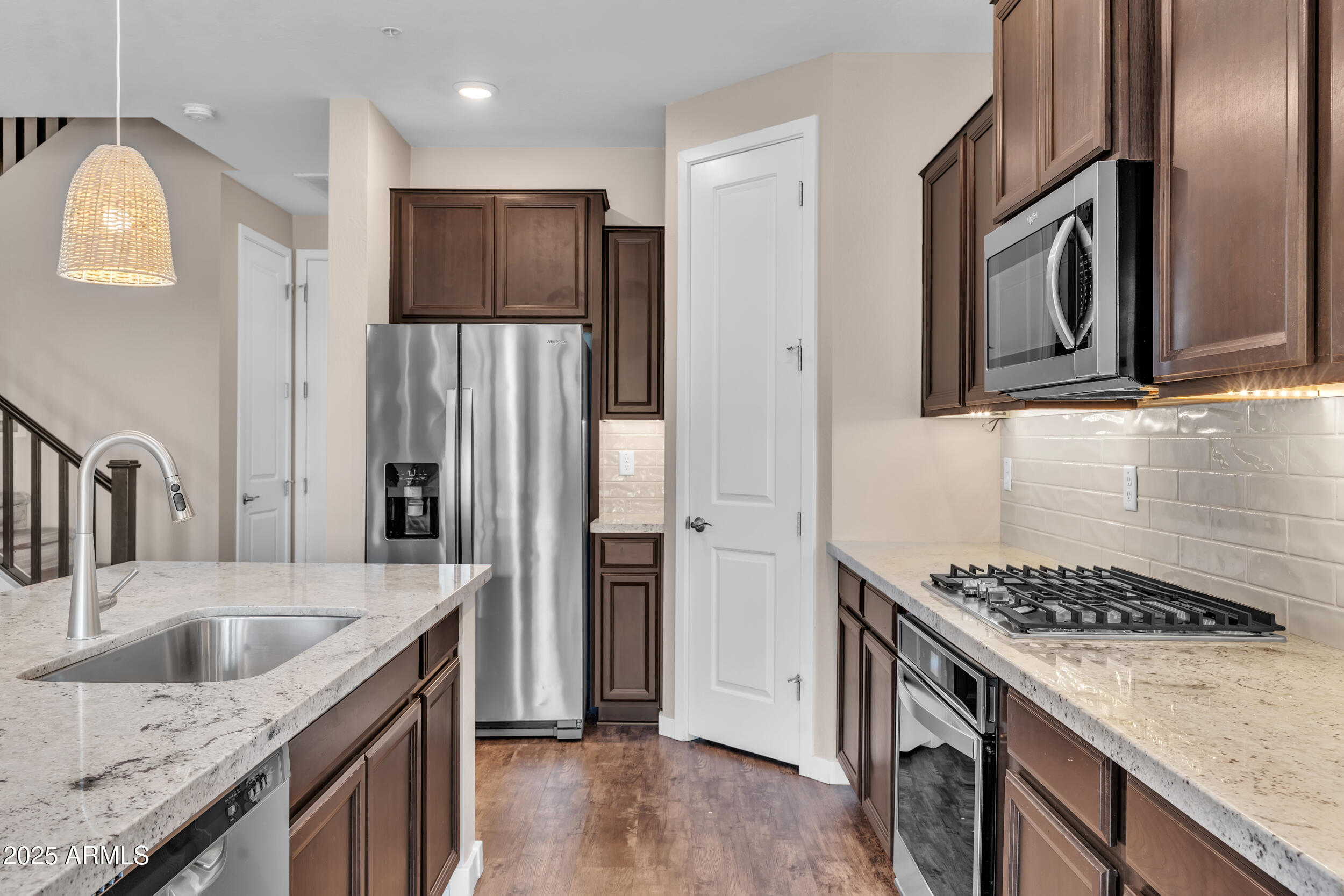 3855 South McQueen Road, Unit 98 Chandler, AZ 85286 - Photo 10 of 41 a kitchen with stainless steel appliances granite countertop a sink stove and refrigerator