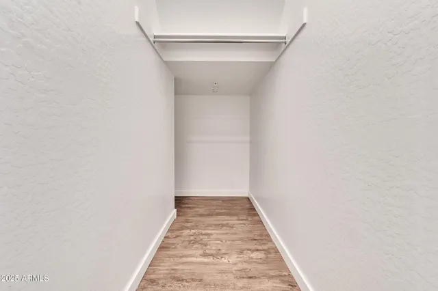 a kitchen with kitchen island stainless steel appliances a refrigerator and a microwave