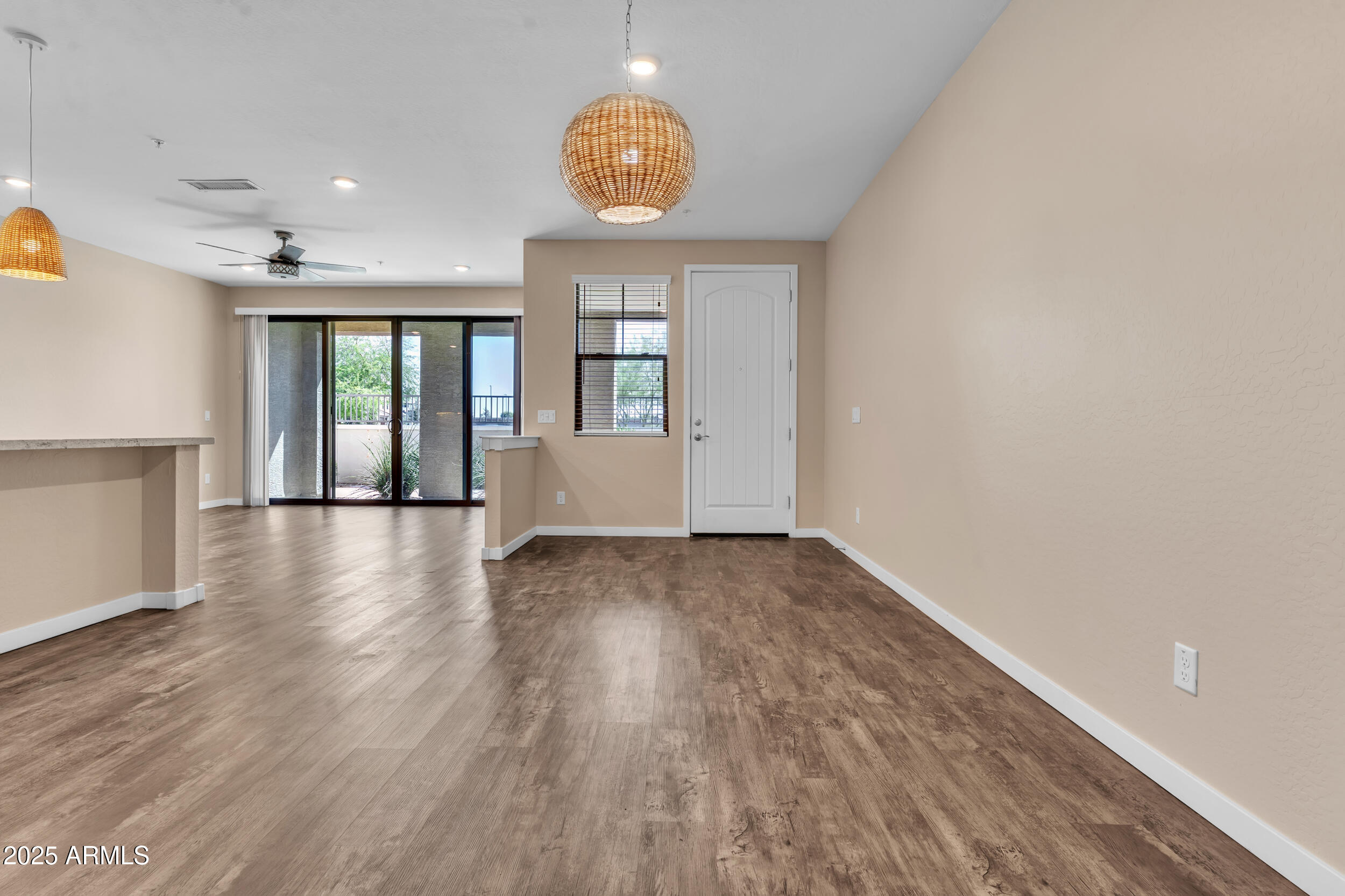 3855 South McQueen Road, Unit 98 Chandler, AZ 85286 - Photo 12 of 41 wooden floor in an empty room with a window