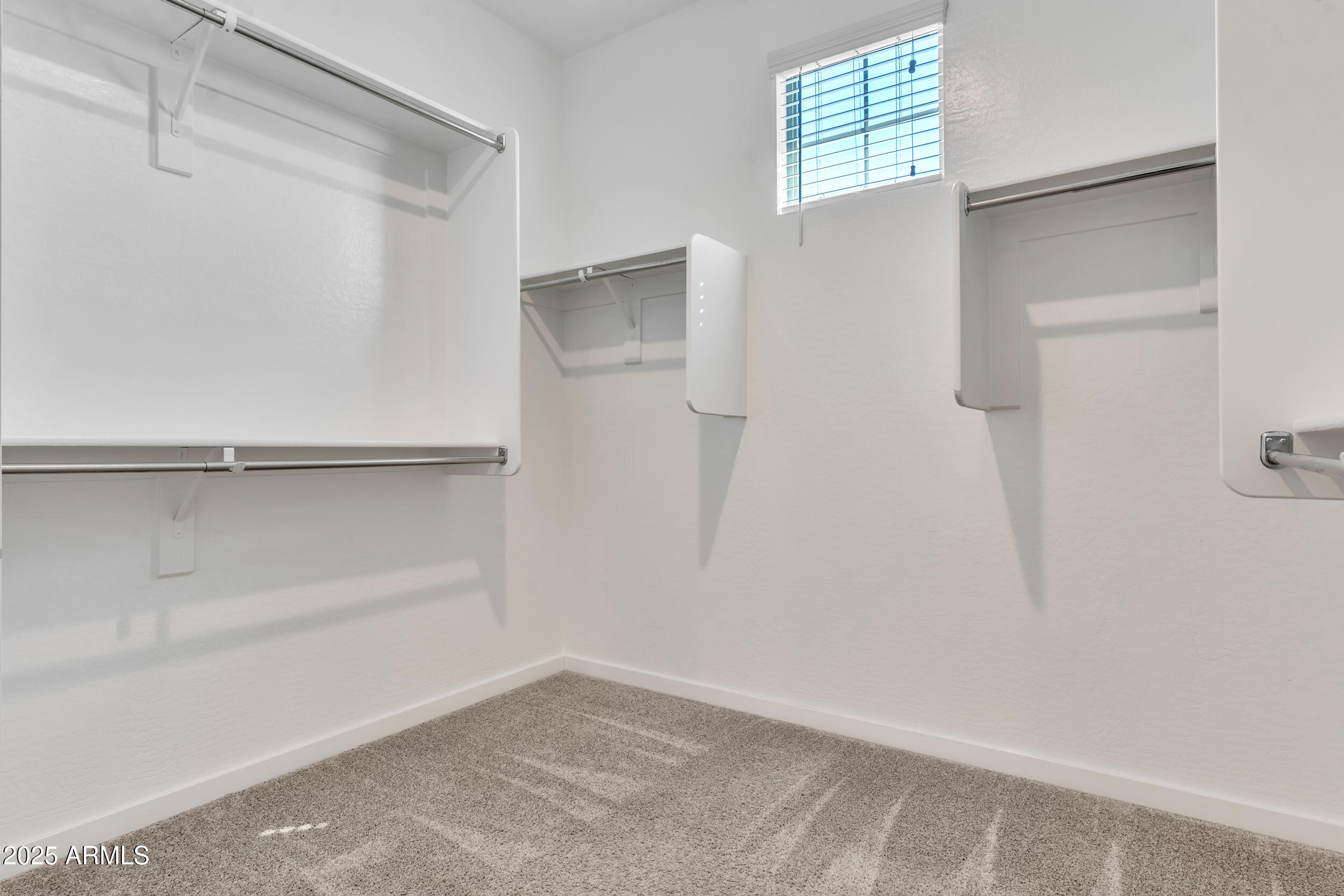 3855 South McQueen Road, Unit 98 Chandler, AZ 85286 - Photo 23 of 41 a view of an empty walk in closet