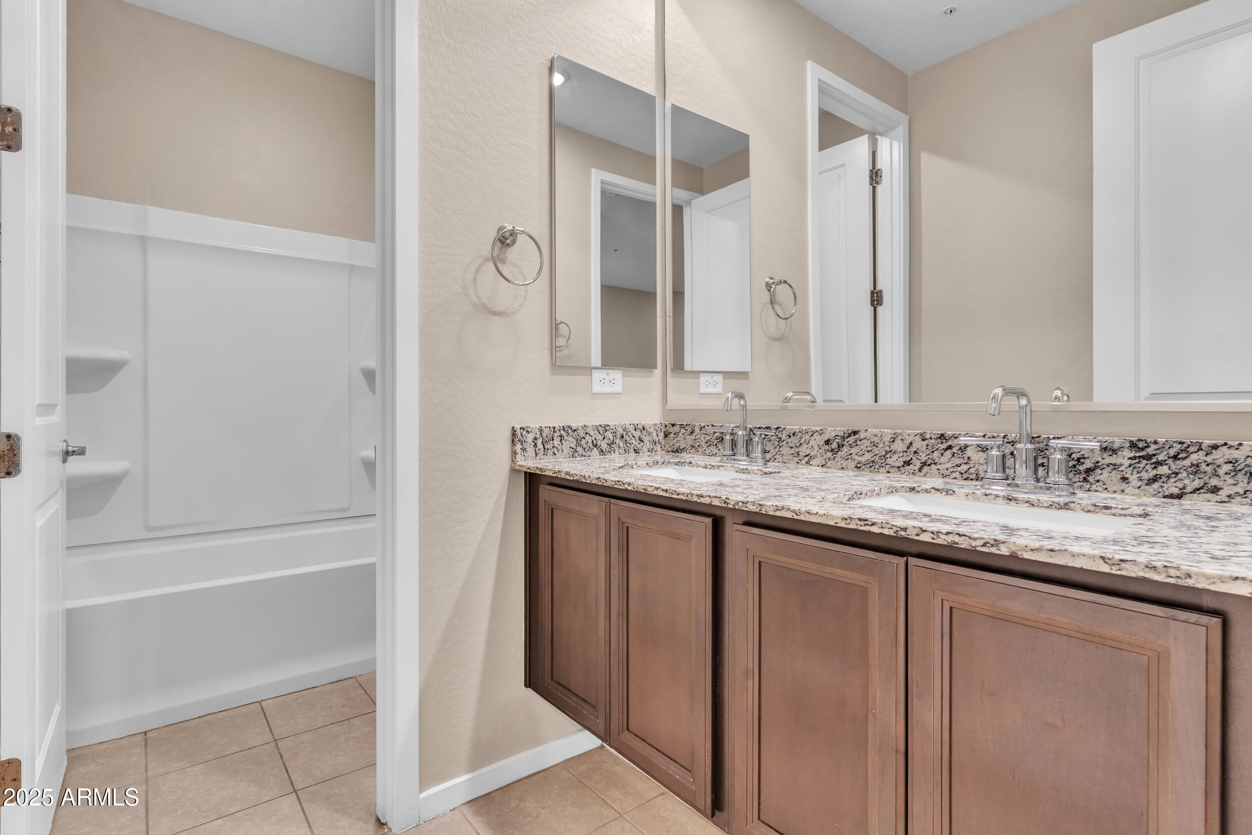 3855 South McQueen Road, Unit 98 Chandler, AZ 85286 - Photo 25 of 41 a bathroom with a granite countertop sink and a mirror