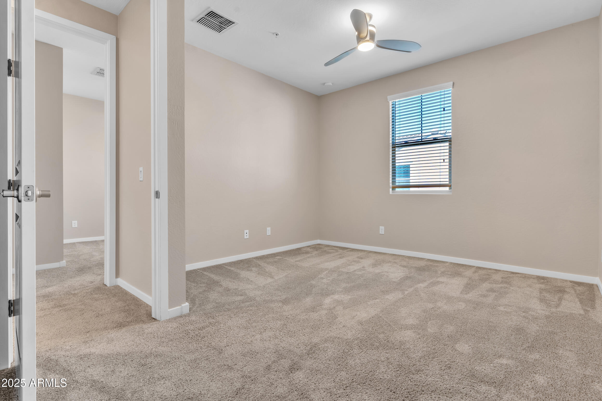 3855 South McQueen Road, Unit 98 Chandler, AZ 85286 - Photo 28 of 41 an empty room with windows and fan