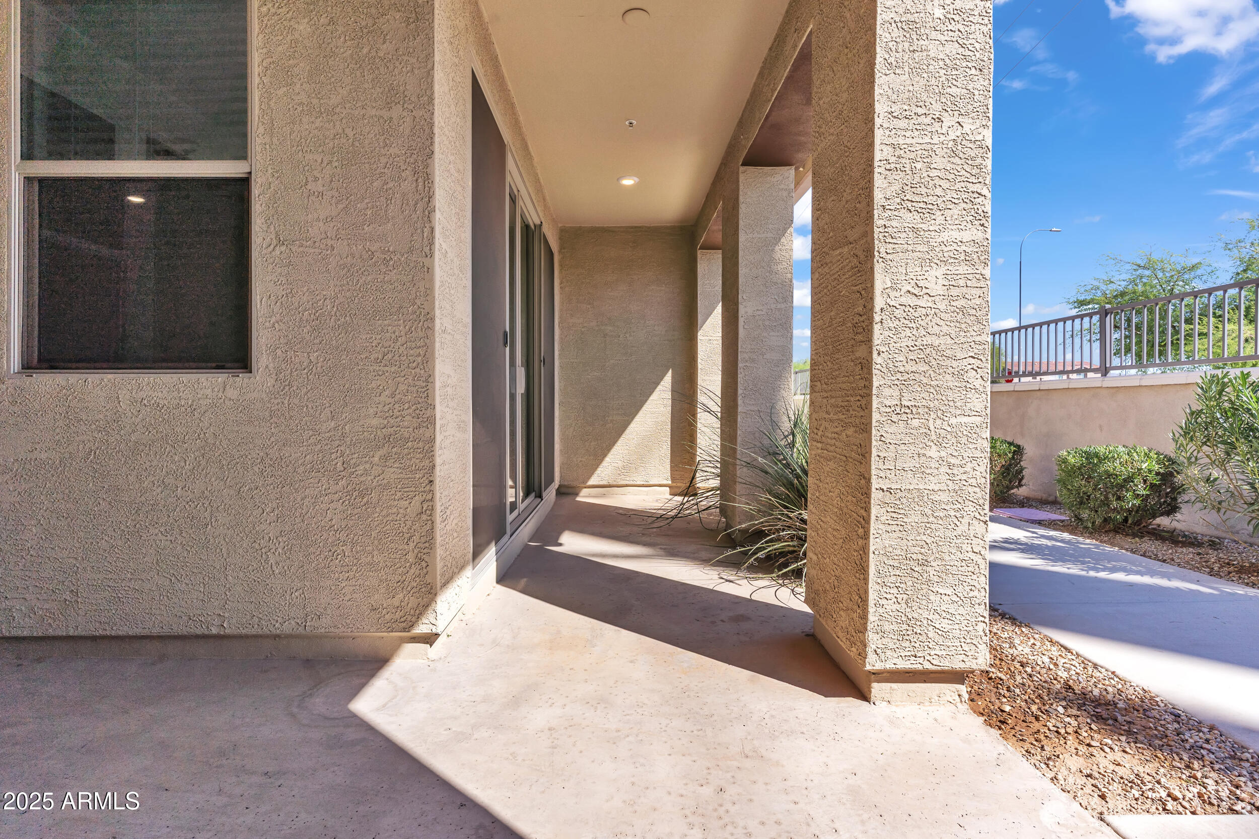 3855 South McQueen Road, Unit 98 Chandler, AZ 85286 - Photo 4 of 41 a view of a hallway with a building