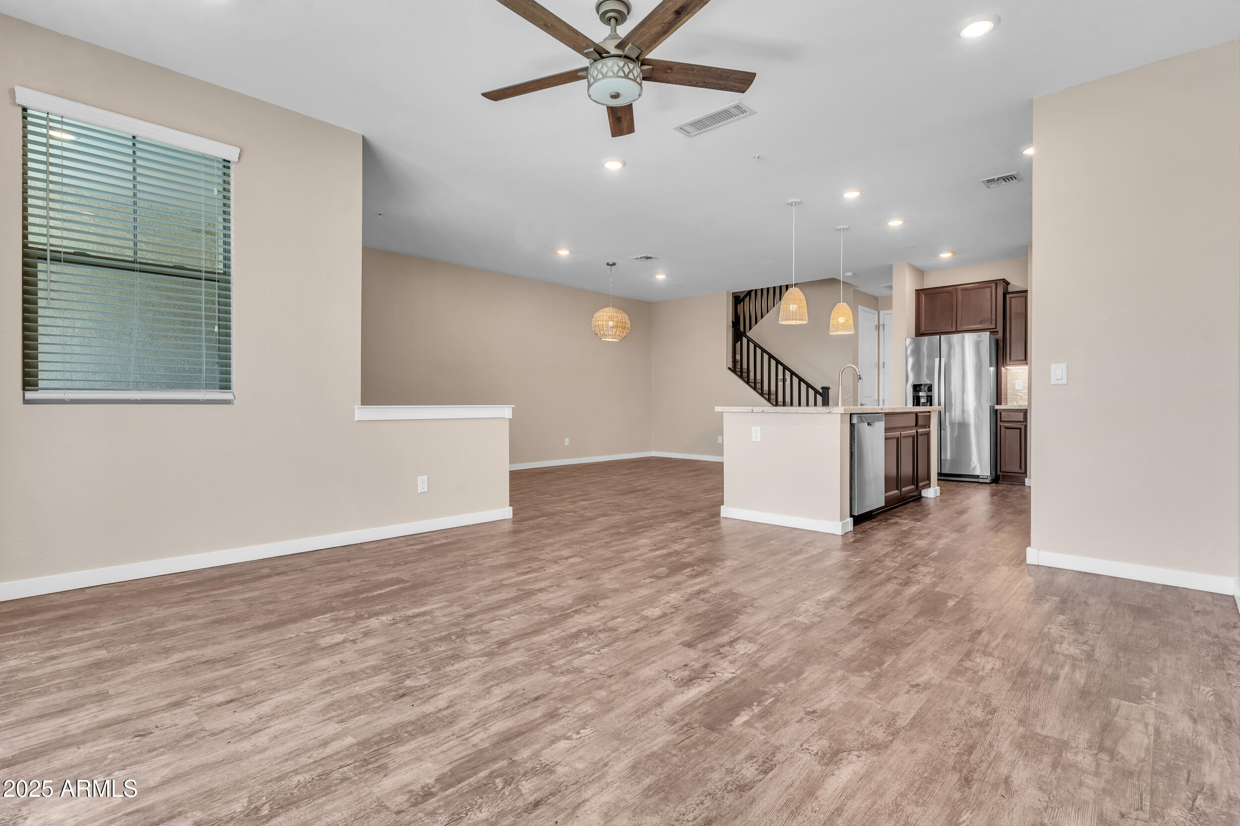 3855 South McQueen Road, Unit 98 Chandler, AZ 85286 - Photo 7 of 41 a view of a kitchen with a stove cabinets and ceiling fan