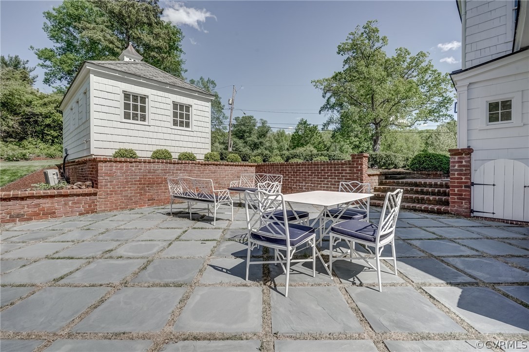 20 Rio Vista Lane Richmond, VA 23226 - Photo 49 of 49 a view of a patio with table and chairs and potted plants