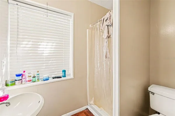 a bathroom with a bathtub sink and toilet