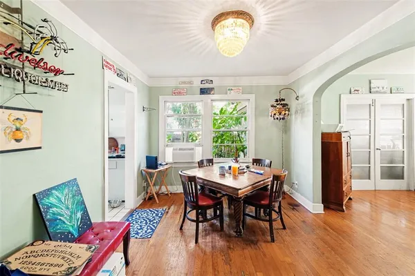 a view of a dining room with furniture window and wooden floor