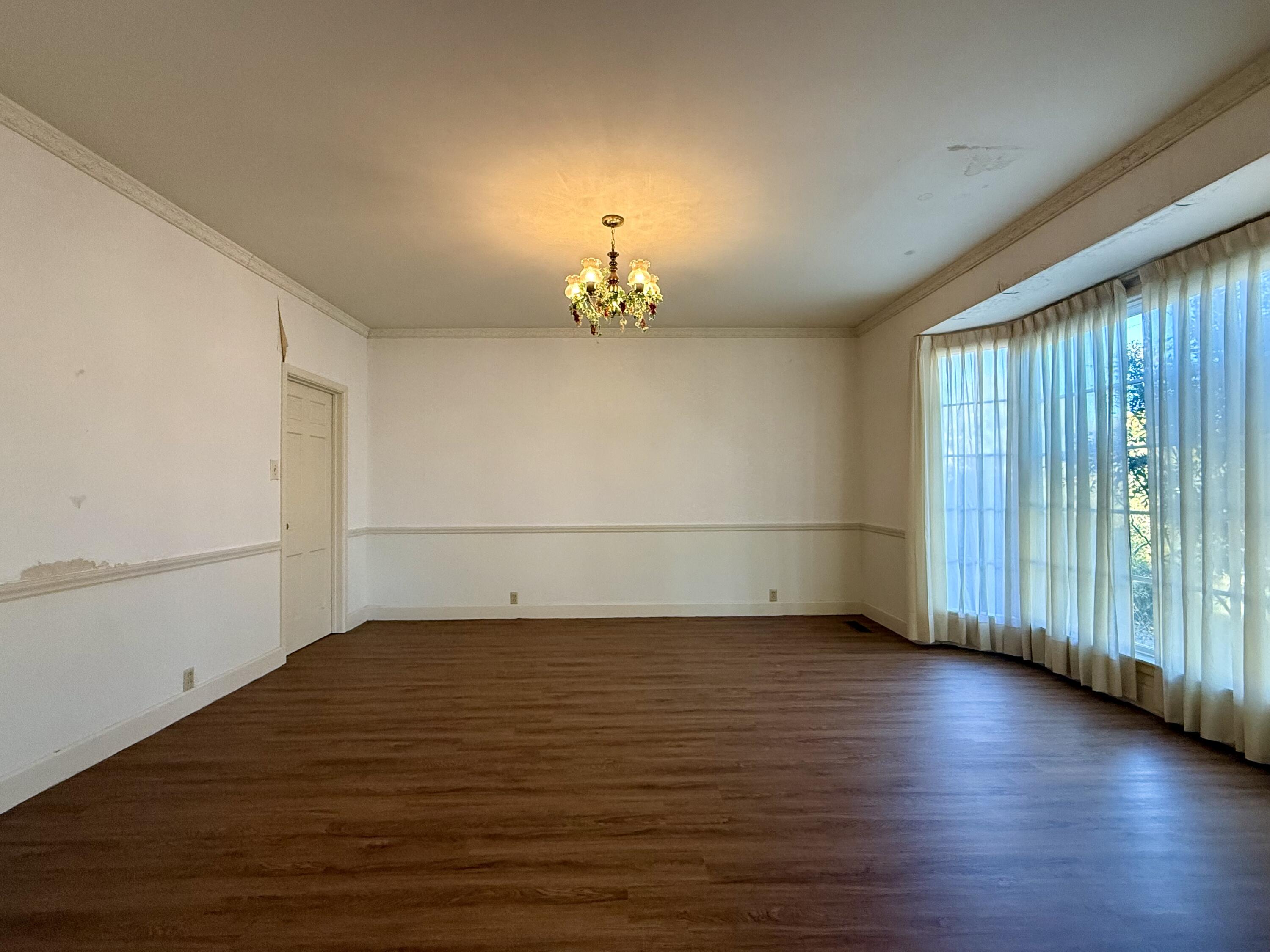 321 10th Street Memphis, TX 79245 - Photo 15 of 33 a view of a room with wooden floor and window