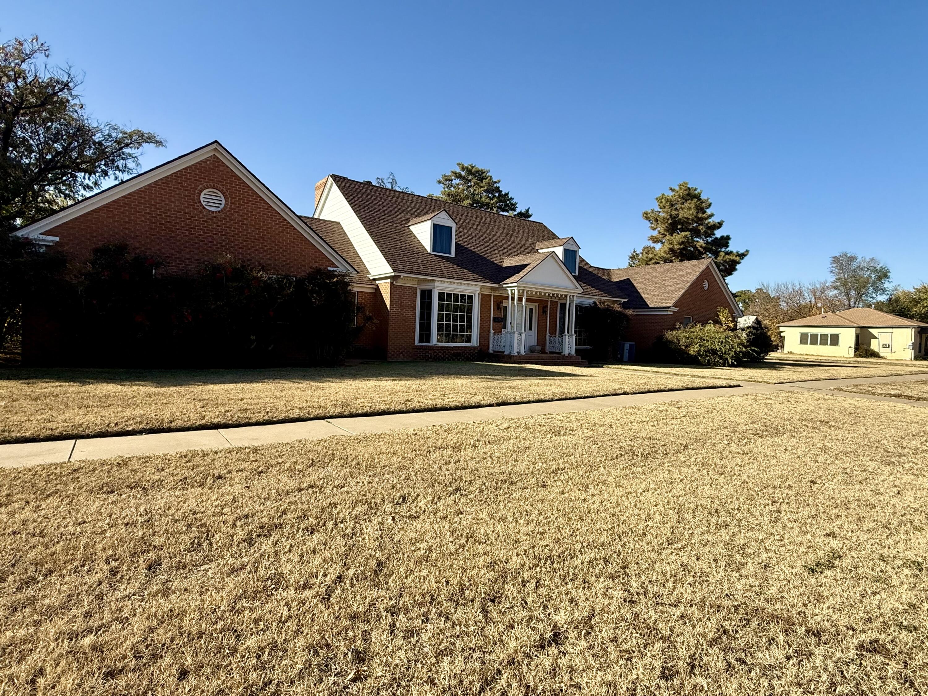 321 10th Street Memphis, TX 79245 - Photo 2 of 33 a front view of a house with a yard