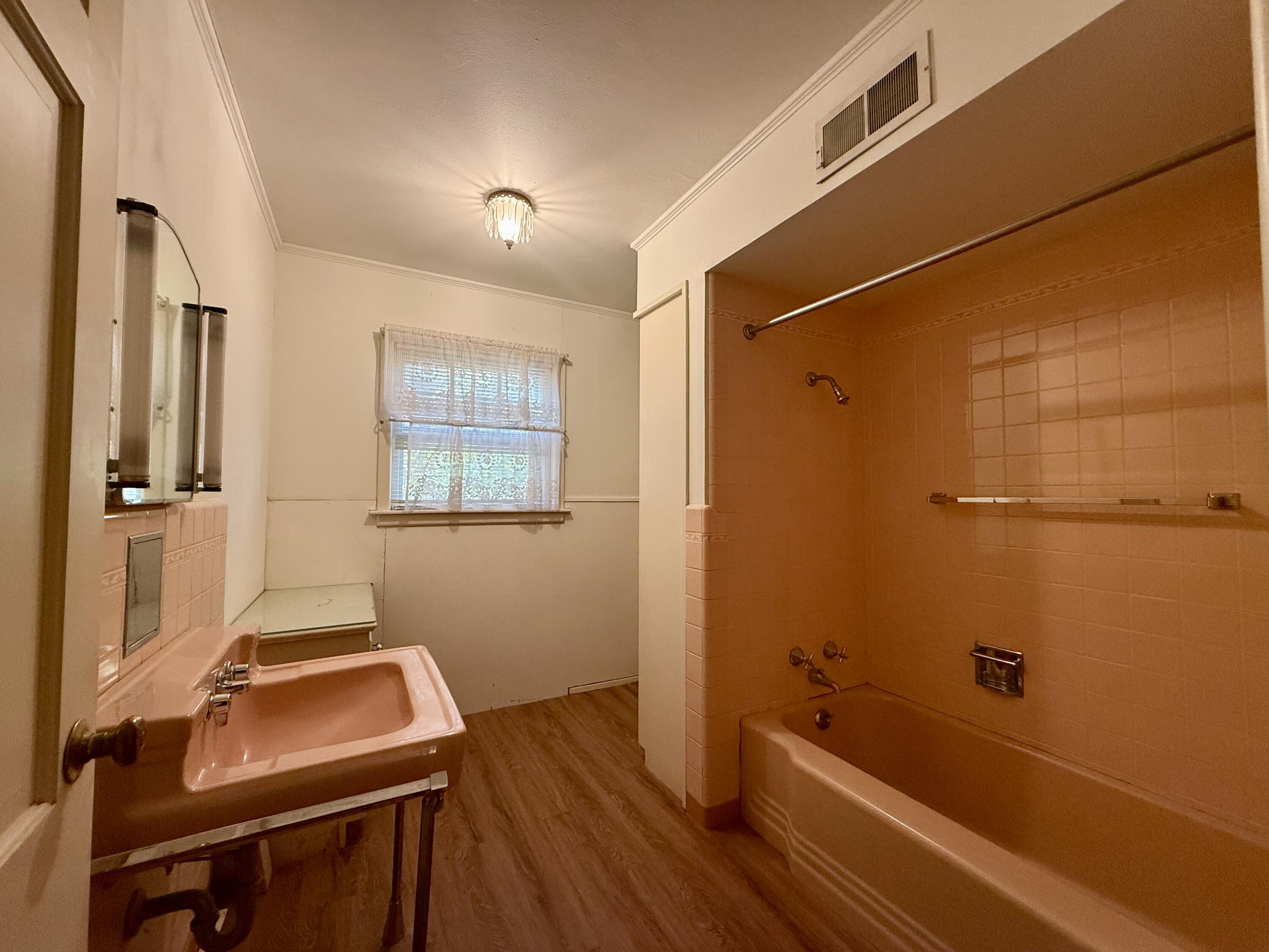 321 10th Street Memphis, TX 79245 - Photo 27 of 33 a bathroom with a sink and a shower