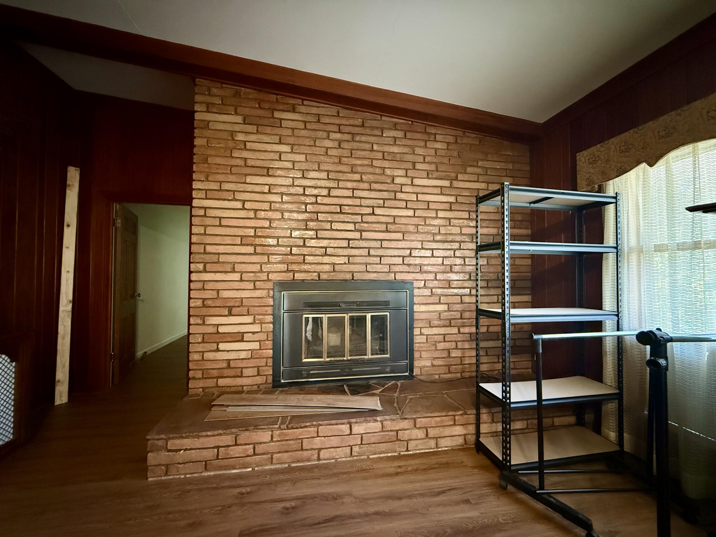321 10th Street Memphis, TX 79245 - Photo 29 of 33 a front view of a house with wooden floor and a fireplace