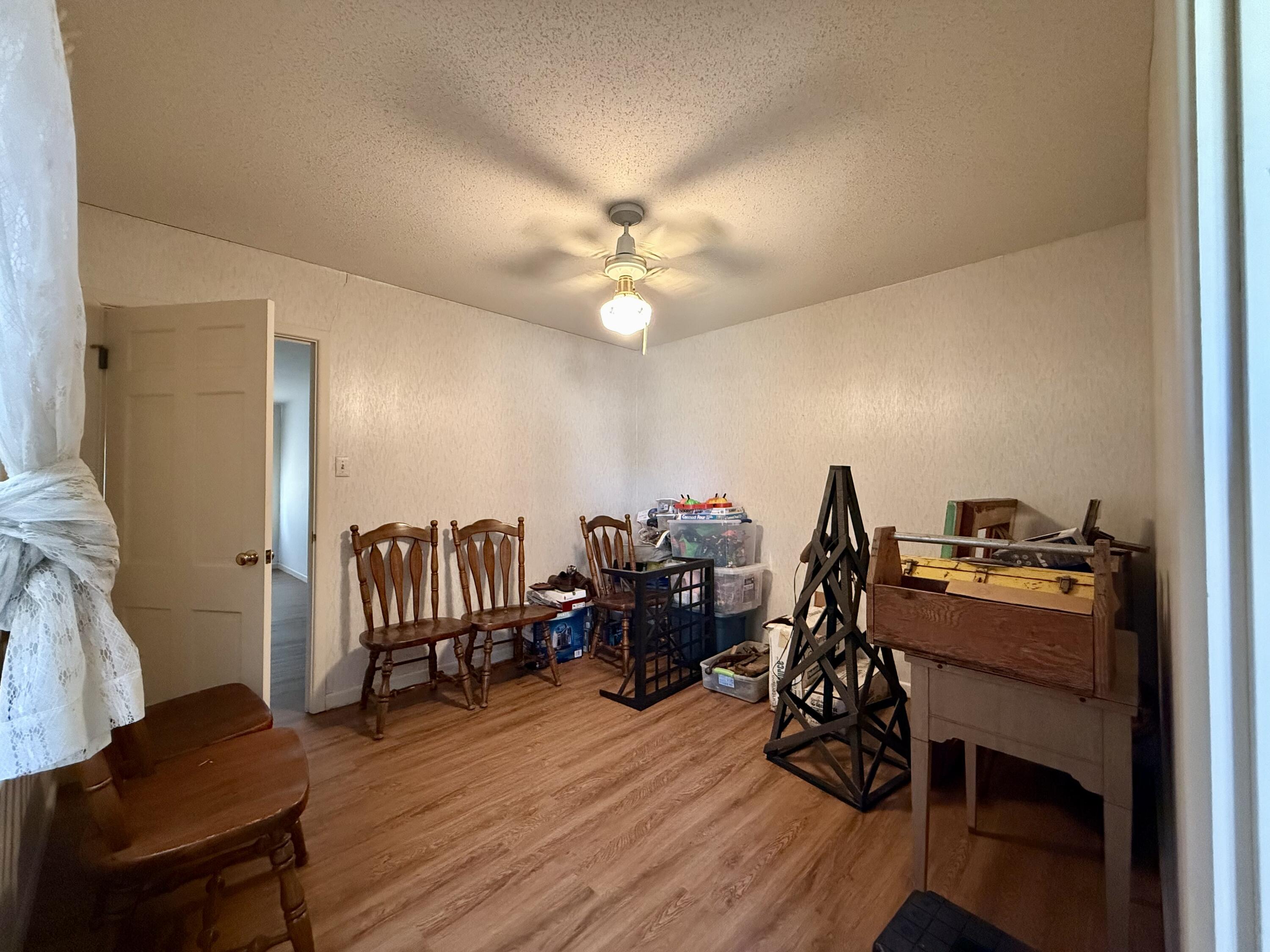 321 10th Street Memphis, TX 79245 - Photo 30 of 33 a workspace with wooden floor