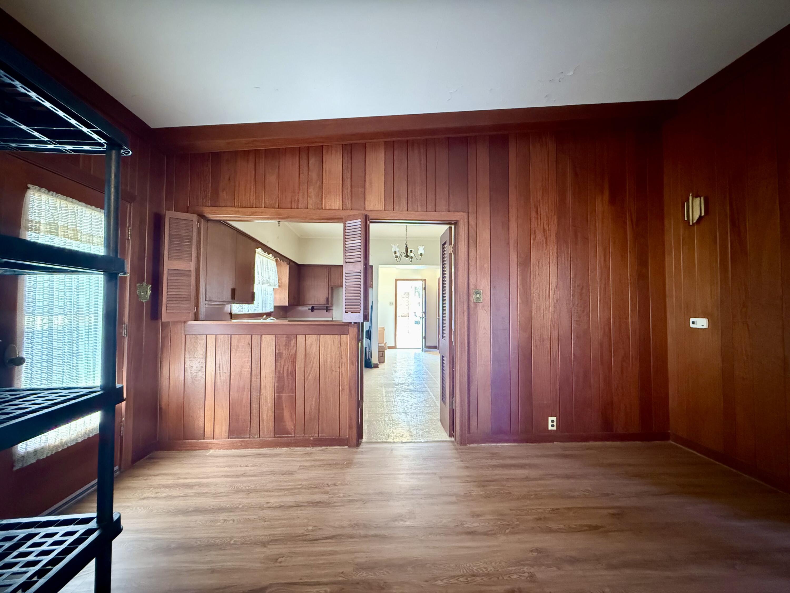 321 10th Street Memphis, TX 79245 - Photo 31 of 33 an empty room with wooden floor and windows