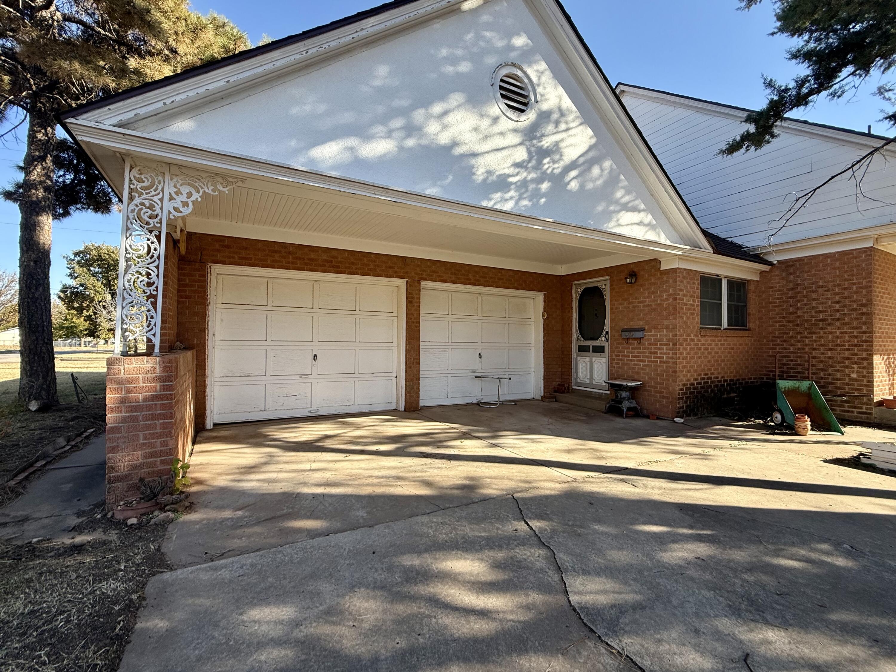 321 10th Street Memphis, TX 79245 - Photo 5 of 33 a view of garage with a large window