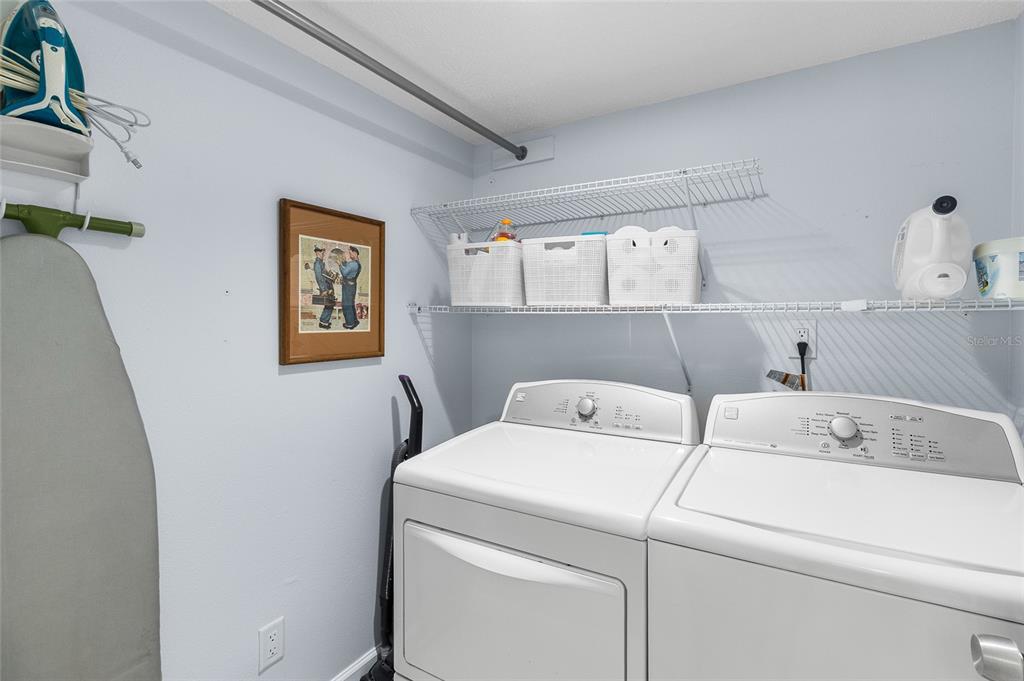 15000 Gulf Boulevard, Unit 605 Madeira Beach, FL 33708 - Photo 21 of 54 a utility room with dryer and washer