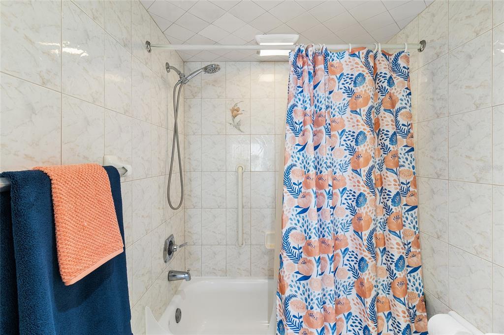 15000 Gulf Boulevard, Unit 605 Madeira Beach, FL 33708 - Photo 24 of 54 a bathroom with a bathtub and a shower