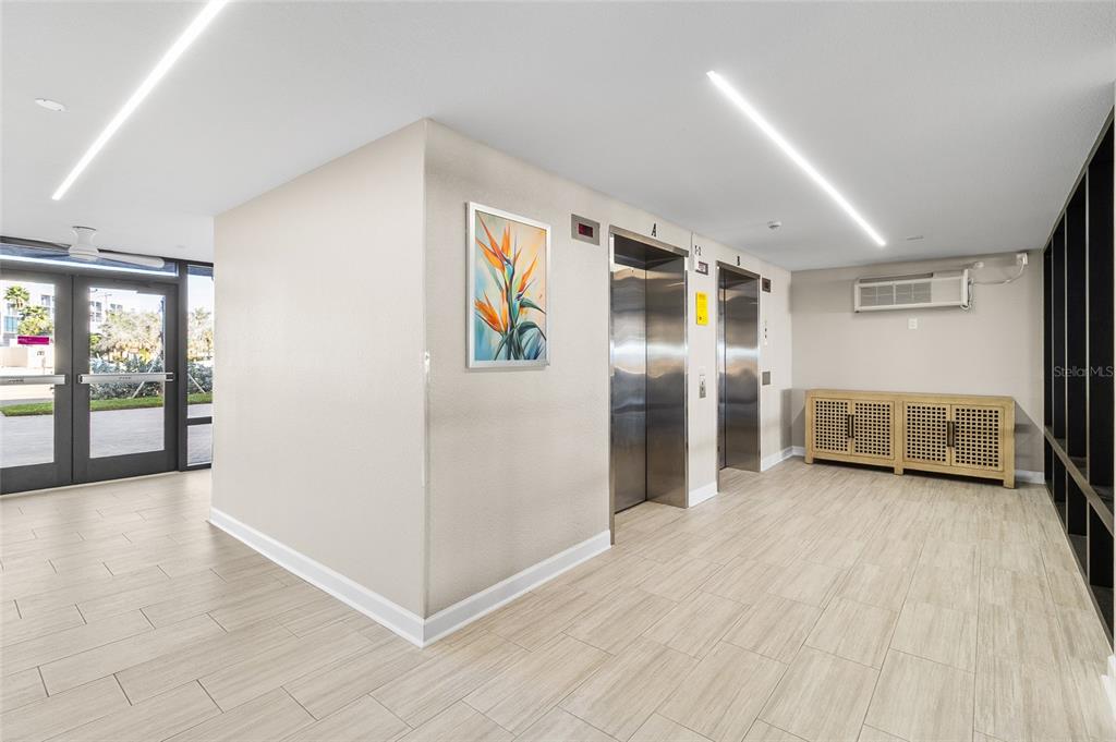 15000 Gulf Boulevard, Unit 605 Madeira Beach, FL 33708 - Photo 34 of 54 a view of a big room with windows and chandelier