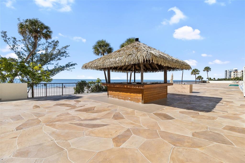 15000 Gulf Boulevard, Unit 605 Madeira Beach, FL 33708 - Photo 41 of 54 a view of a swimming pool with a patio