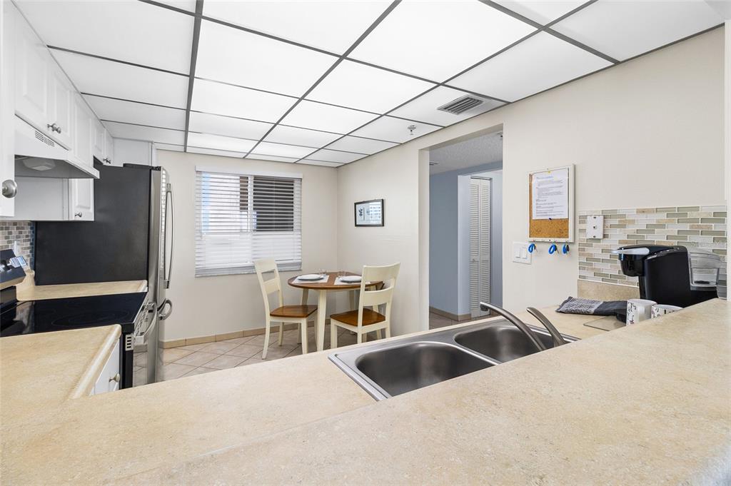 15000 Gulf Boulevard, Unit 605 Madeira Beach, FL 33708 - Photo 9 of 54 a bedroom with furniture and a flat screen tv