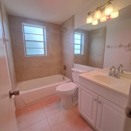 a bathroom with a sink a toilet and a bathtub