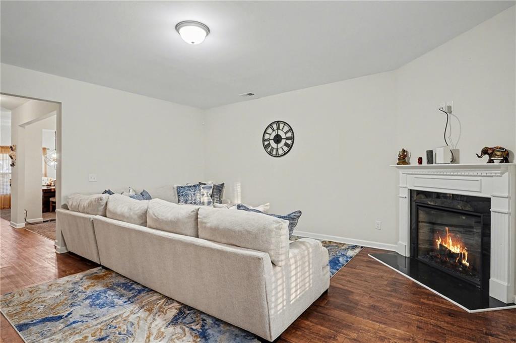 1241 England Terrace Hampton, GA 30228 - Photo 2 of 20 a living room with furniture and a fireplace