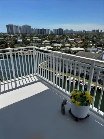 a view of a balcony with an outdoor seating