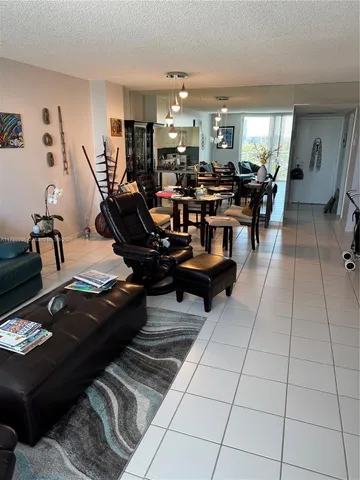 a living room with lots of furniture and gym equipment