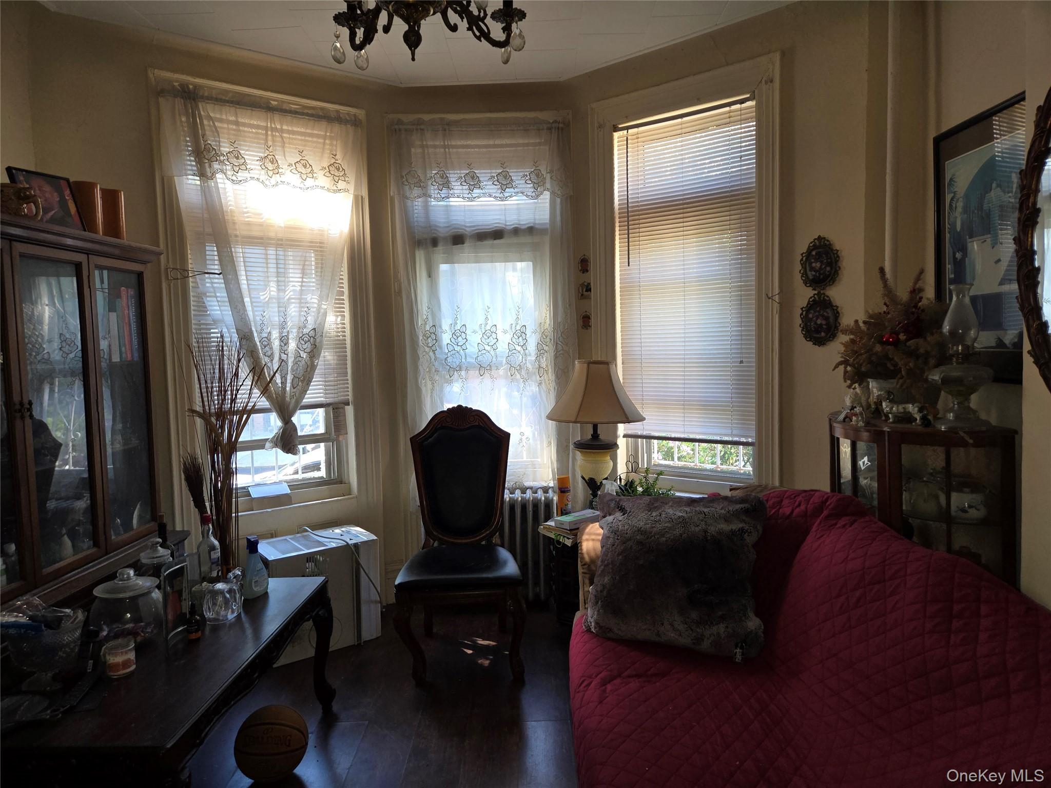 343 Rutland Road Brooklyn, NY 11225 - Photo 11 of 17 a living room with furniture and a flat screen tv
