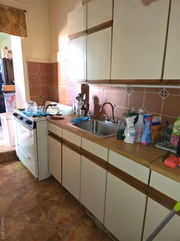 a kitchen with a sink and cabinets