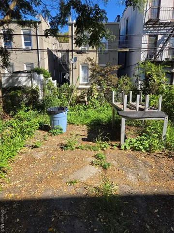 a view of a garden with a fountain