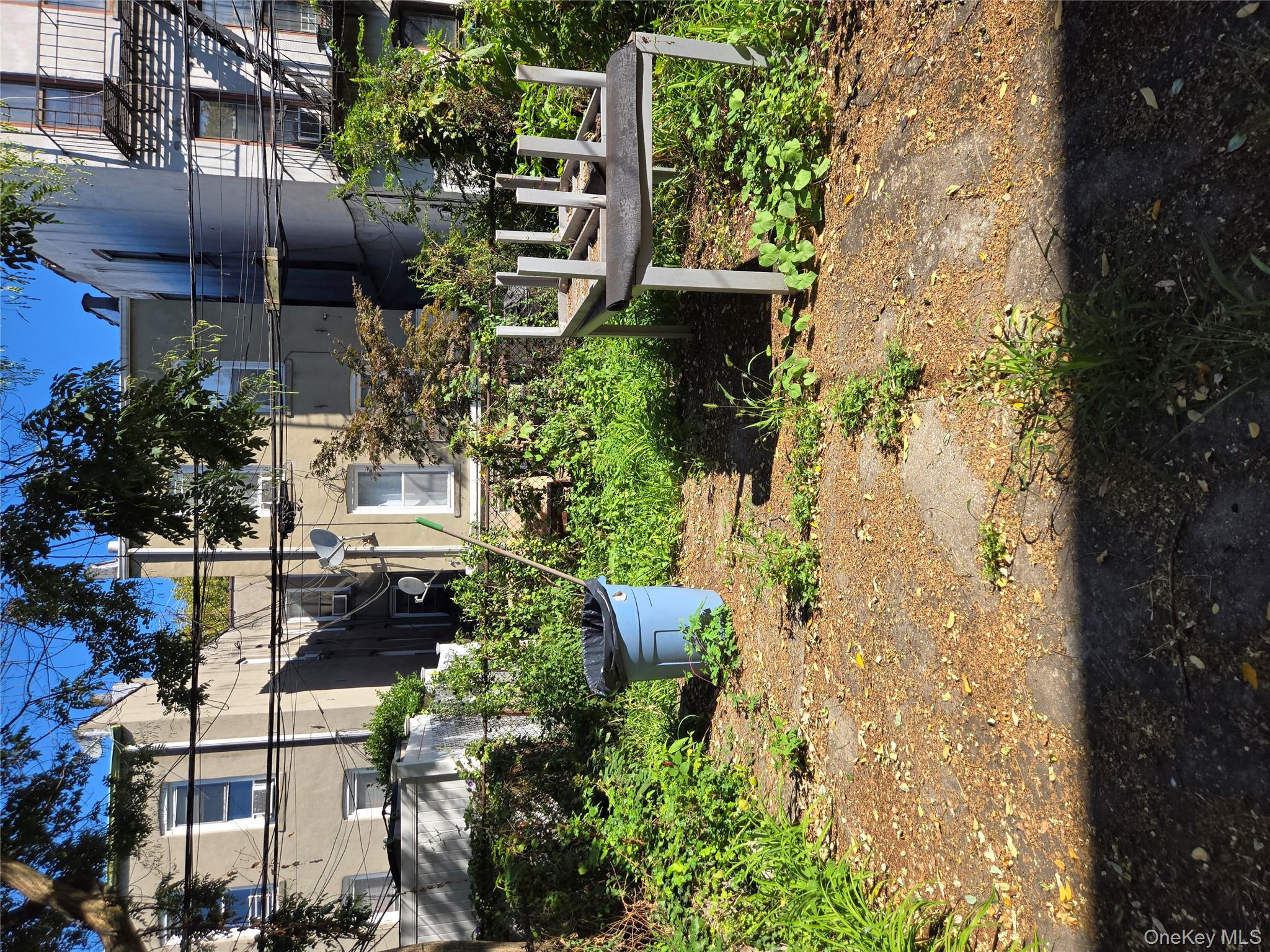 343 Rutland Road Brooklyn, NY 11225 - Photo 16 of 17 a view of a garden with a fountain