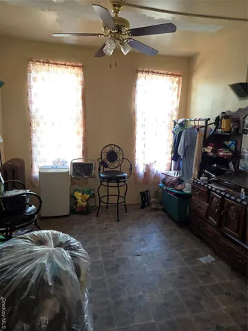 a bed room with furniture and a window