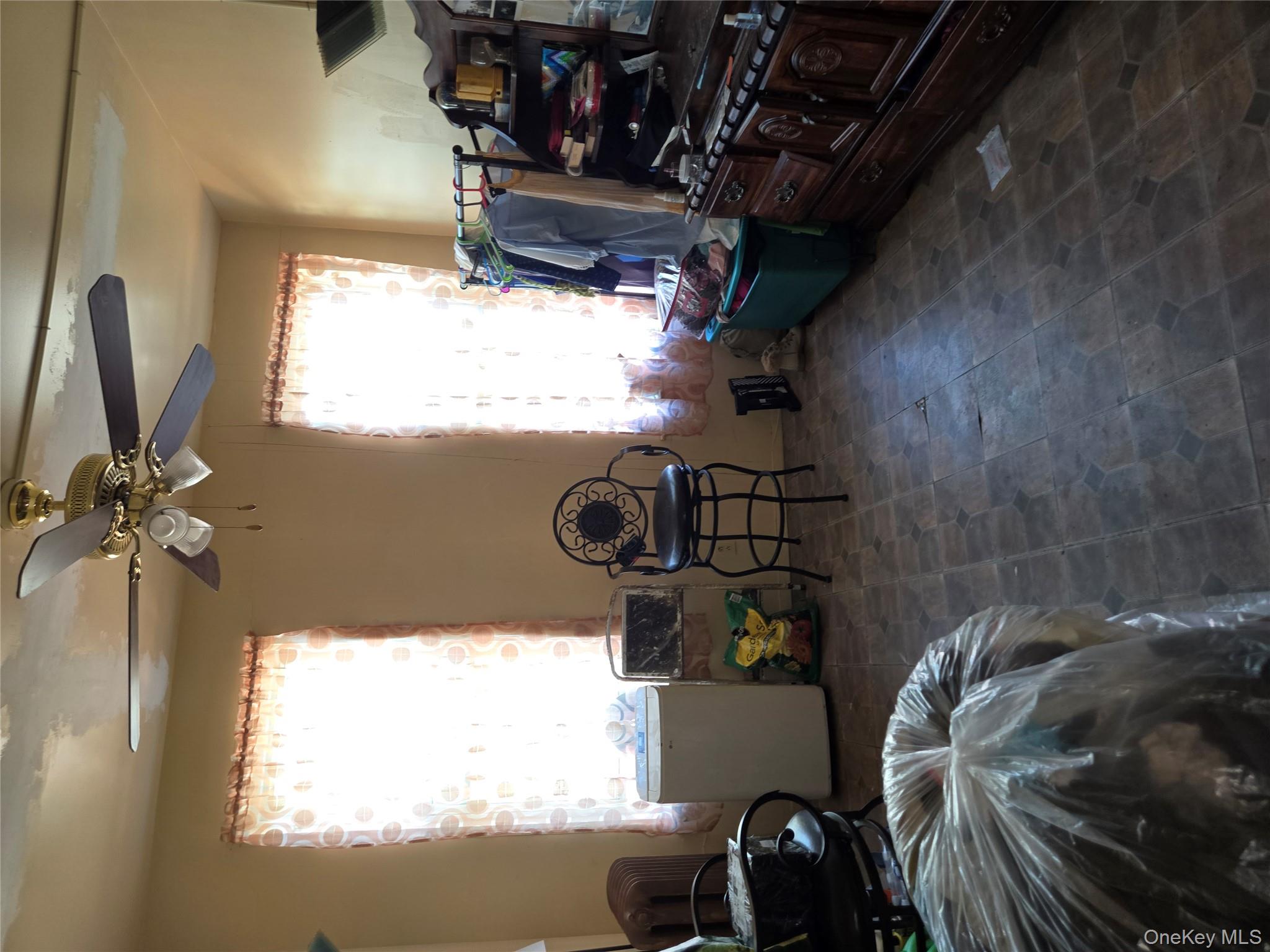 343 Rutland Road Brooklyn, NY 11225 - Photo 5 of 17 a bed room with furniture and a window