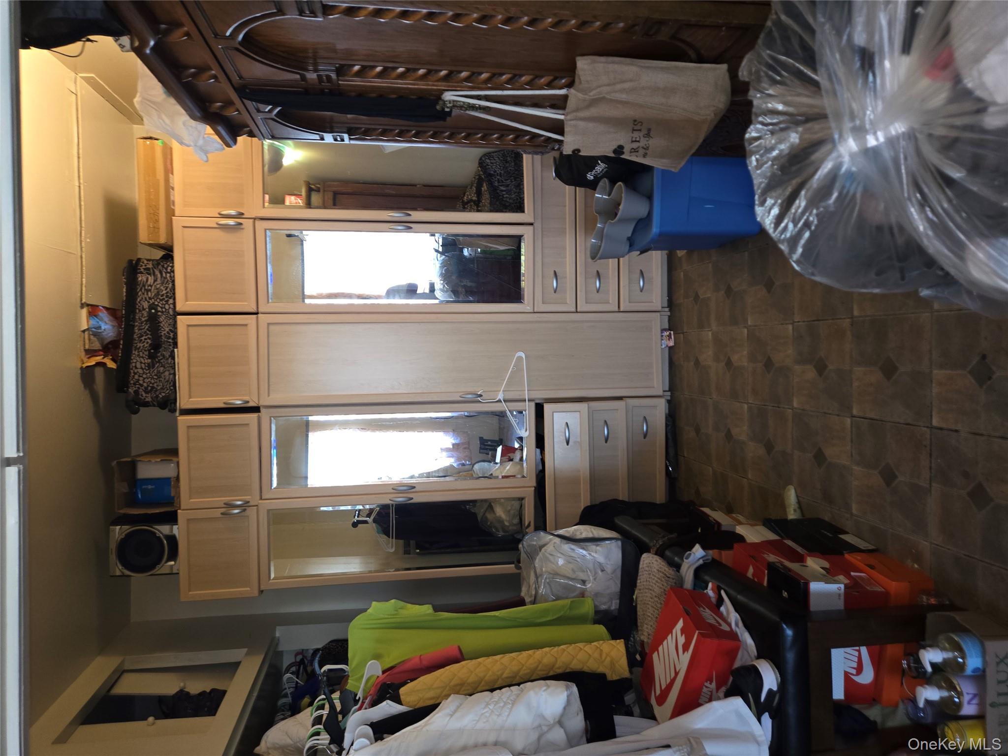 343 Rutland Road Brooklyn, NY 11225 - Photo 6 of 17 a living room with furniture a flat screen tv and a refrigerator