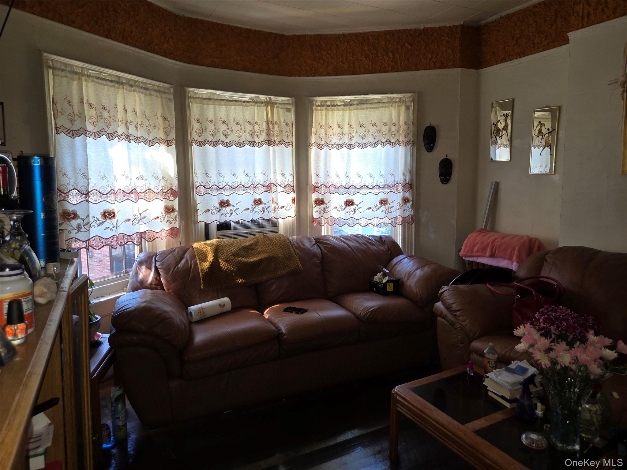 343 Rutland Road Brooklyn, NY 11225 - Photo 8 of 17 a living room with furniture and a large window
