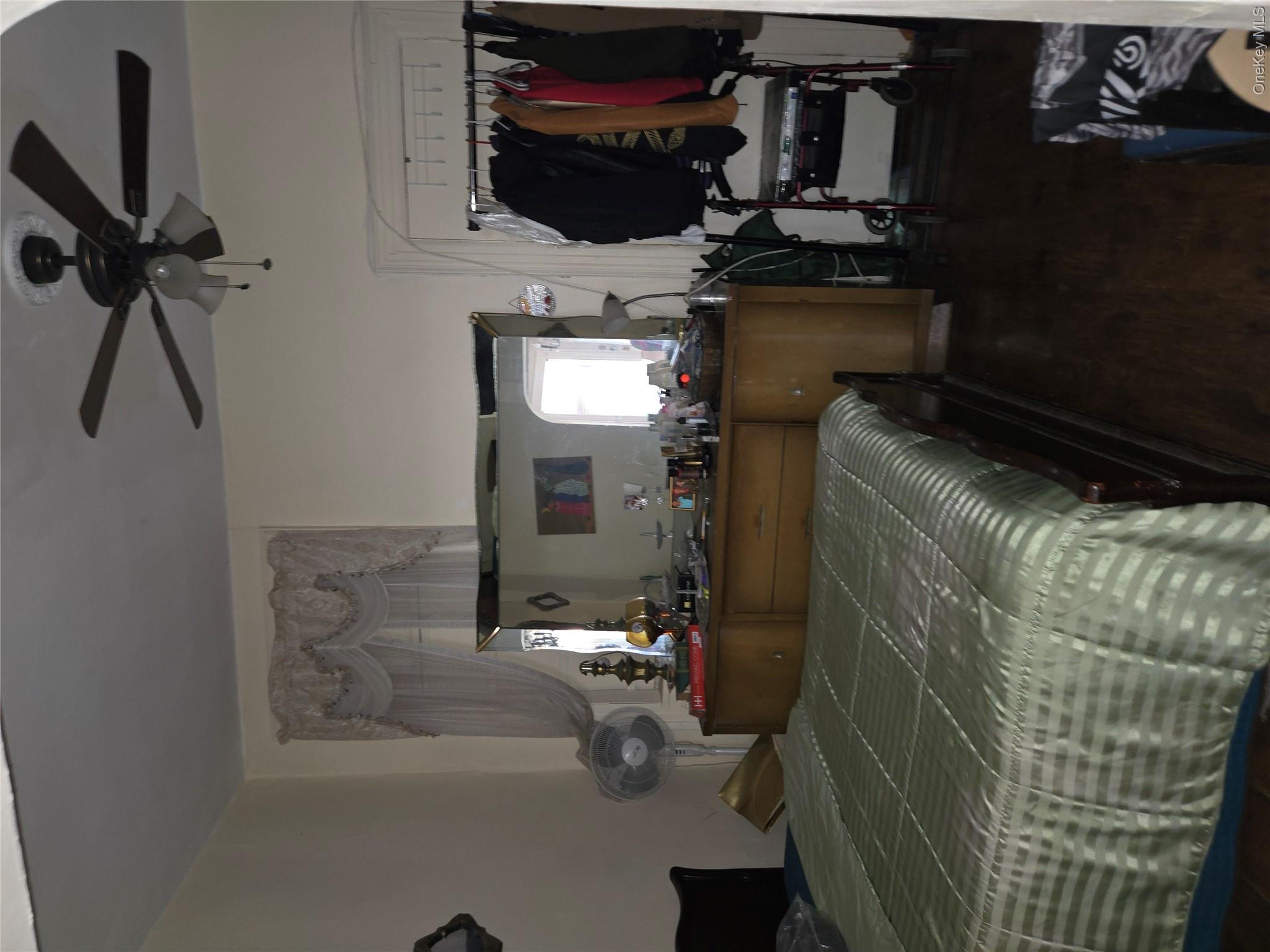 343 Rutland Road Brooklyn, NY 11225 - Photo 10 of 17 Bedroom featuring dark wood-style flooring and ceiling fan