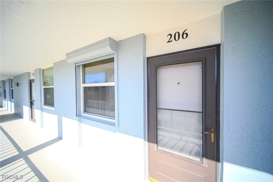 5959 Winkler Road, Unit 206 Fort Myers, FL 33919 - Photo 21 of 50 a bathroom with a bathtub and mirror