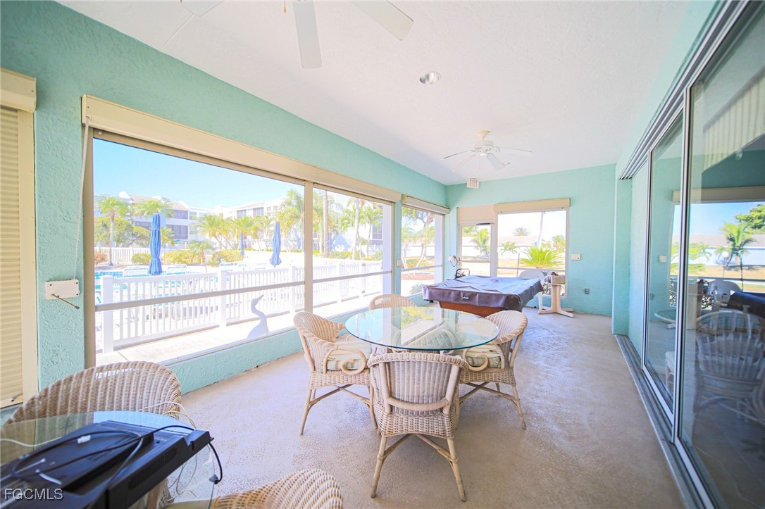 5959 Winkler Road, Unit 206 Fort Myers, FL 33919 - Photo 26 of 50 a dining room with furniture and wooden floor