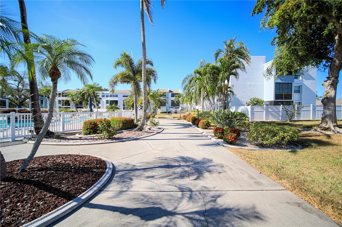 5959 Winkler Road, Unit 206 Fort Myers, FL 33919 - Photo 35 of 50 a view of a backyard and palm tree