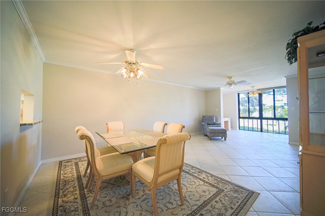 5959 Winkler Road, Unit 206 Fort Myers, FL 33919 - Photo 4 of 50 a living room with furniture and a chandelier