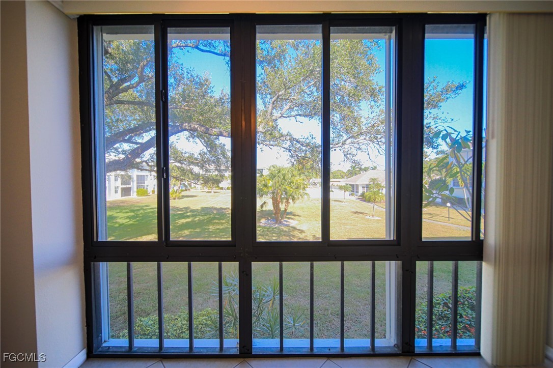 5959 Winkler Road, Unit 206 Fort Myers, FL 33919 - Photo 7 of 50 a view of a blue door and deck